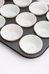 paper muffin cups on baking pan