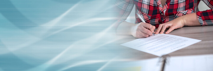 Woman hands signing a document; panoramic banner