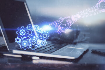 Double exposure of desktop computer and technology theme hologram. Concept of software development.