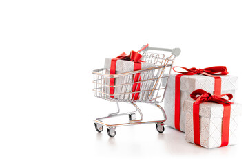 Xmas sale. Trolley cart for supermarket with christmas or birthday gift box isolated on white...