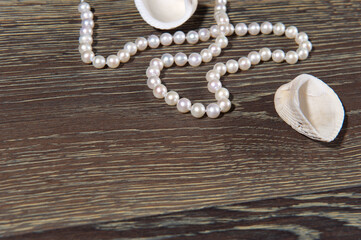 Abstract background with pearl beads and seashells