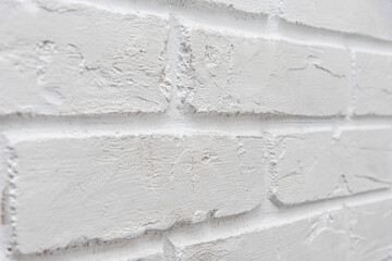 the surface of the brickwork is painted white