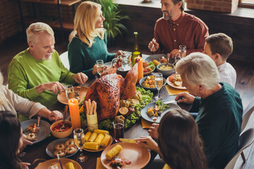 Holiday feast table family relatives gathering thanks giving dinner communication living room...