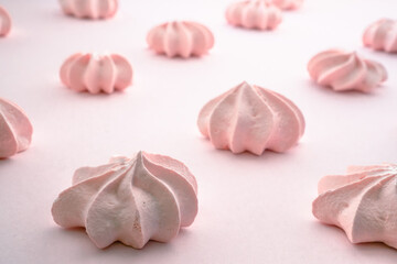 Pink meringue close up with blurred background