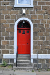 Stone Building with Stepped Entrance & Red Painted Door 