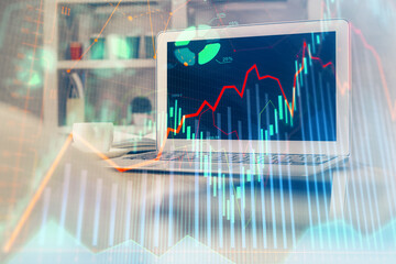 Stock market graph and table with computer background. Multi exposure. Concept of financial analysis.