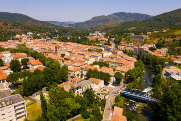 Fototapeta na wymiar Scenic aerial view of residential areas of French commune of Quillan on Aude River in summer, Occitanie