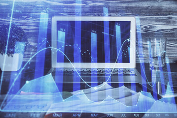 Financial market graph hologram and personal computer on background. Multi exposure. Concept of forex.