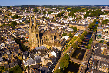 Drone view of summer cityscape of Quimper on Odet river with Gothic Roman Catholic cathedral,...
