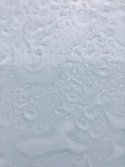 Water droplets on the gray background.