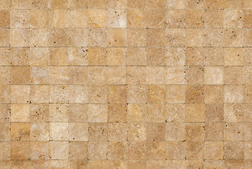 Seamless wall background with Yellow natural sandstone tiles stiched together with clay