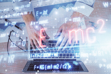 Science formula hologram with man working on computer on background. Education concept. Double exposure.