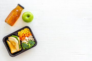 Overhead view of food delivery lunch boxes with meal