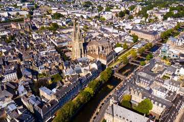 Scenic aerial view of French city of Quimper and medieval gothic cathedral at sunny summer day