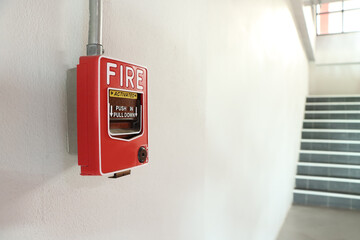 Fire alarm on the white wall.