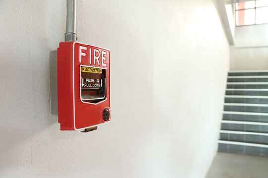Fire alarm on the white wall.