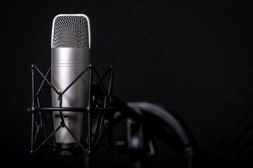 Sound and voice recording studio with nobody. Vintage style microphone and tools for record in room...