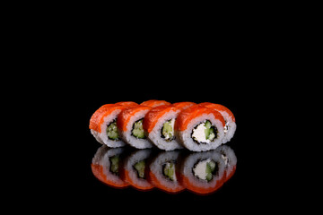 Fresh delicious beautiful sushi rolls on a dark background