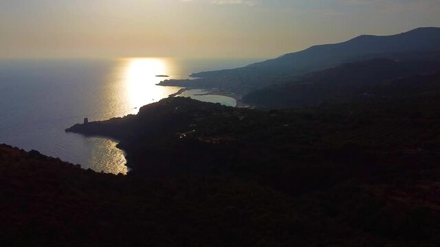 anning of areal view of Marina di Camerota city in backlight at sunset