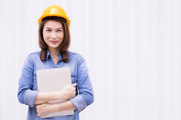 Female engineer working at construction site.