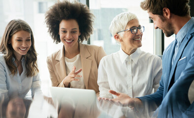 Business colleagues in conference meeting room during presentation