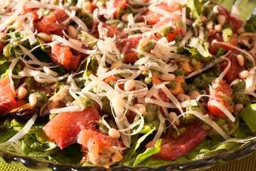 Seafood salad with pesto and pine nuts.
