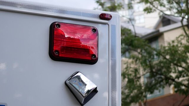Close up of ambulance car light flashing and waiting patient in rescue action with 4k resolution