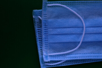 Medical masks on a green background. Respiratory protection.