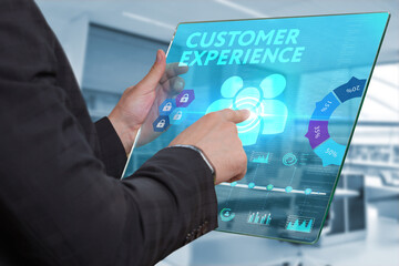 Business, Technology, Internet and network concept. Technology future. Young businessman, working on the smartphone of the future, clicks on the virtual display button: Customer Experience.