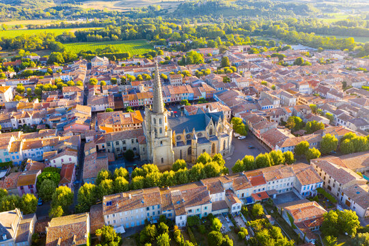 Scenic aerial view of Mirepoix town and surroundings in Hers valley in summer overlooking Gothic building of Roman Catholic Cathedral, France..