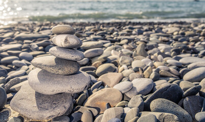 Stack stones on the coast of the sea in the nature.
