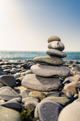 Fototapeta na wymiar Stack stones on the coast of the sea in the nature.
