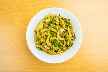 A dish of home-cooked sauerkraut on a wooden table