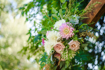 Fresh flower decoration of a wedding arch - pink and white fresh flowers. Fresh roses flower arrangement