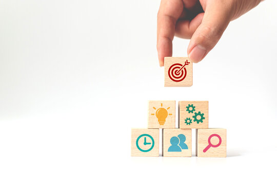 Concept Of Business Strategy And Action Plan. Hand Putting Wooden Cube Block Stacking With Icon On White Background