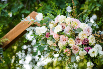 Fresh flower decoration of a wedding arch - pink and white fresh flowers. Fresh roses flower arrangement