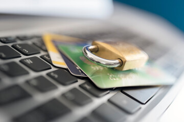 Computer internet credit card security with padlock on laptop