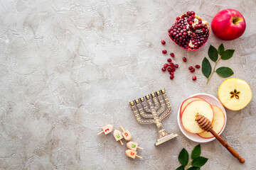 Jewish cuisine for rosh hashana holiday - apple honey and pomegranate, top view