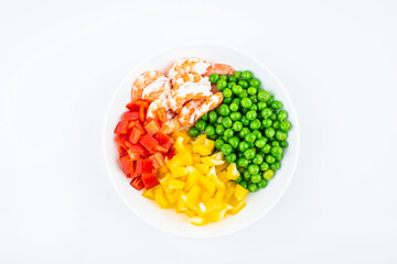 A dish of fresh pea bell peppers with shrimps on a white background