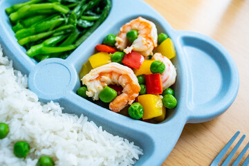 A plate of nutritious children's meal on the table