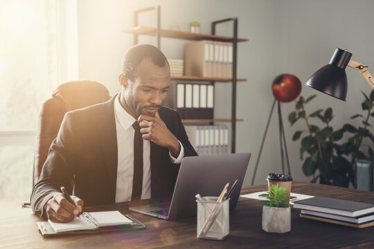 Portrait of his he nice attractive chic skilled smart clever focused guy marketer director writing plan strategy agenda appointment meeting week month at work place station indoors