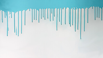 Blue paint dripping on white wall