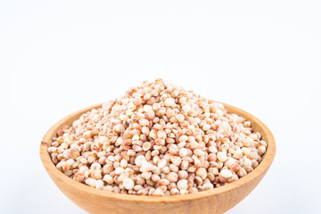 Grain grain sorghum rice in a dish on white background