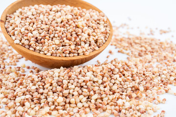 Grain grain sorghum rice in a dish on white background