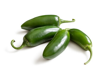 Green Mexican jalapeno peppers on a white background