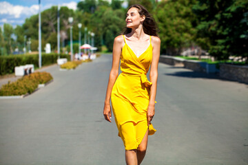 portrait of a young blonde girl in yellow dress