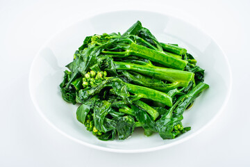 Fried kale cabbage heart in a dish on white background
