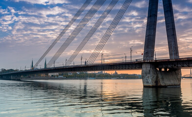 Morning view on the cable stayed bridge and ancient  buildings of old Riga.