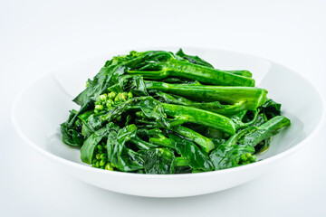 Fried kale cabbage heart in a dish on white background