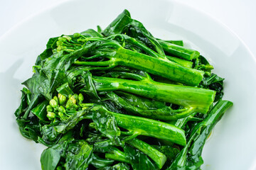 Fried kale cabbage heart in a dish on white background